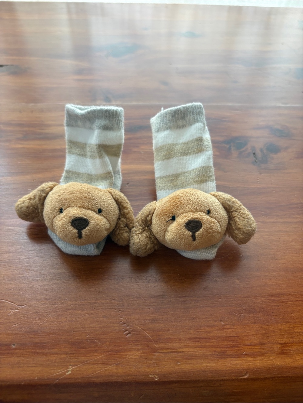 Infant socks with Golden Retriever rattle detail.
